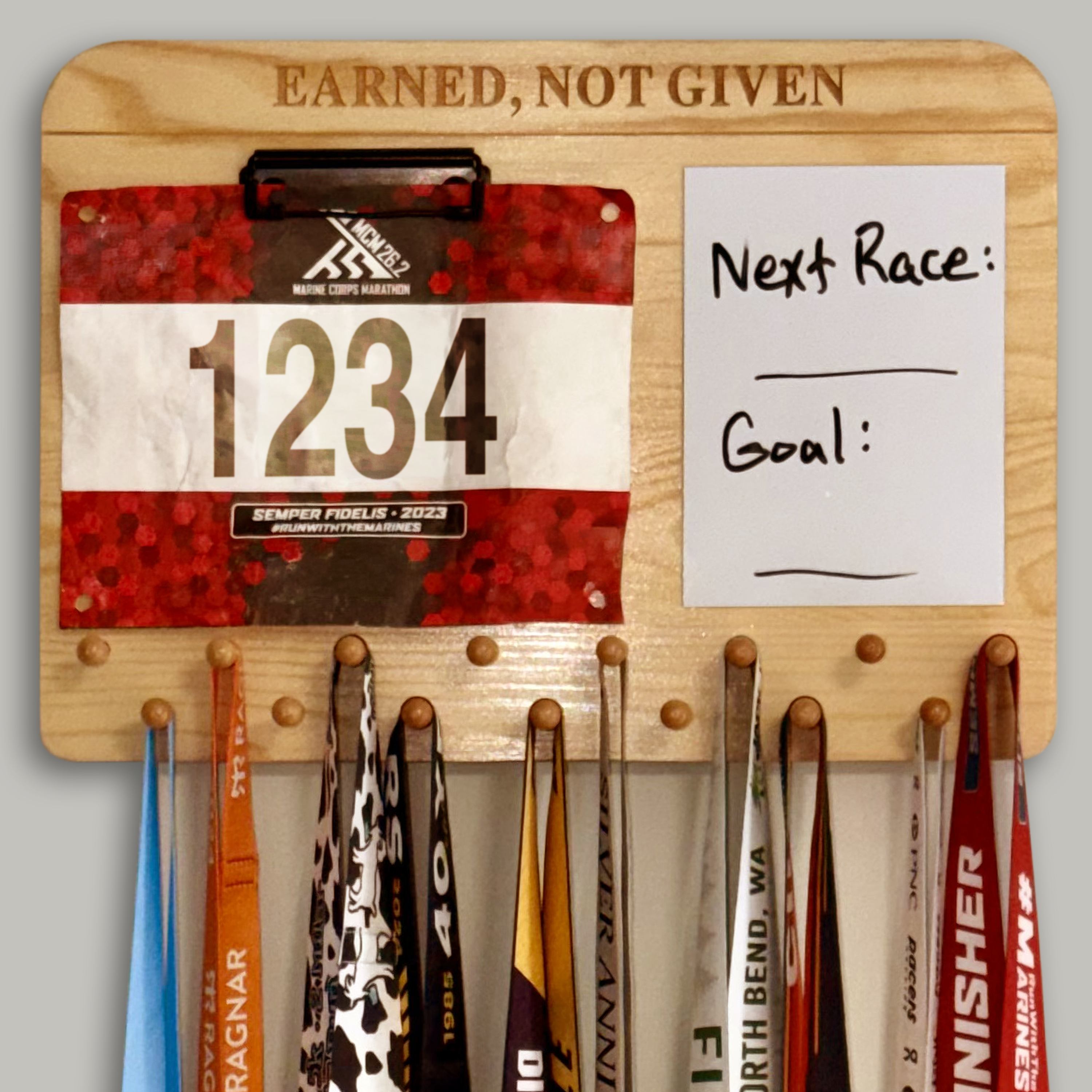 Close view of a race bib held by the integrated metal clip