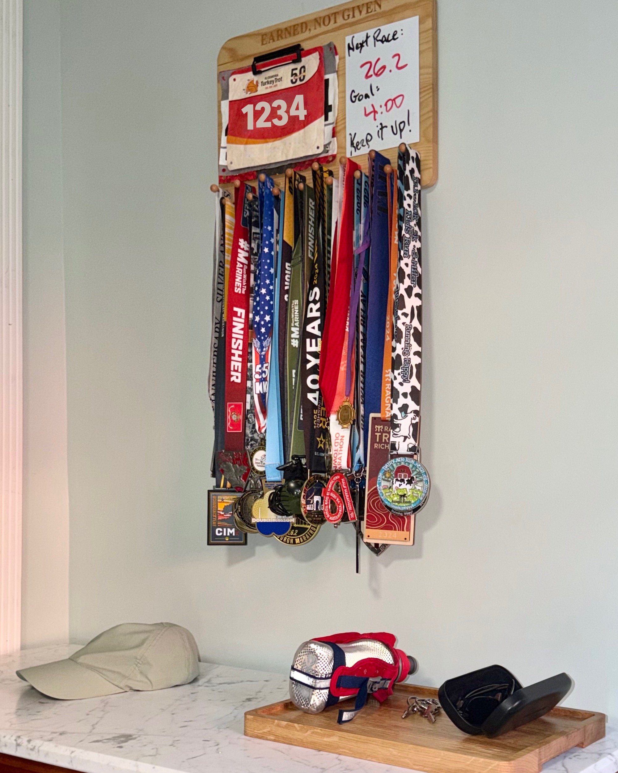 Medal display installed above an entry counter with running gear