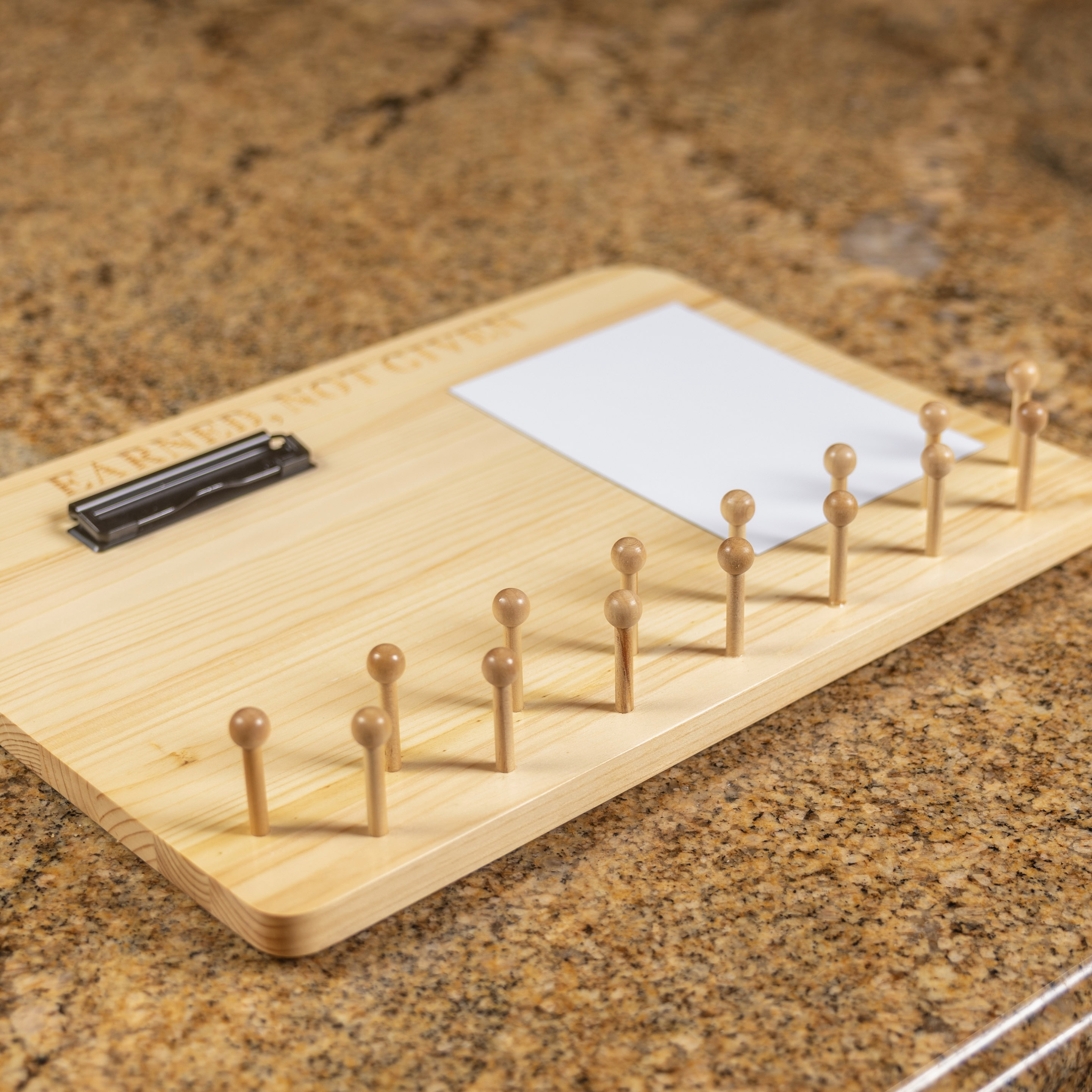 Close view of the staggered solid wood medal pegs
